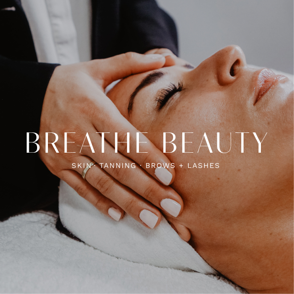 photo of a woman's face having a beauty treatment. A white Breathe Beauty logo is overlaid on the image.